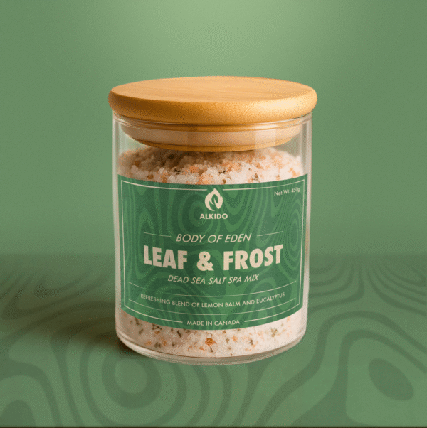 ALKIDO LEAF FROST SPA SALT MIX in a glass jar with dried lemon balm and coconut milk powder. Crisp herbal bath soak handcrafted in Canada.