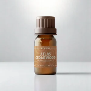 ALKIDO Atlas Cedarwood organic essential oil in an amber glass bottle with a brown label and brown cap on a light background
