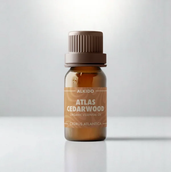 ALKIDO Atlas Cedarwood organic essential oil in an amber glass bottle with a brown label and brown cap on a light background