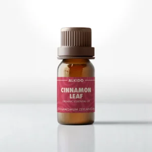 ALKIDO Cinnamon Leaf organic essential oil in an amber glass bottle with a red label and brown cap on a light background