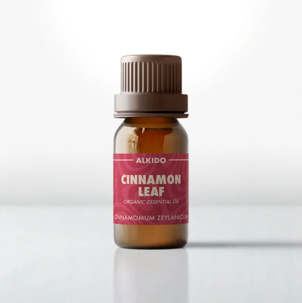 ALKIDO Cinnamon Leaf organic essential oil in an amber glass bottle with a red label and brown cap on a light background