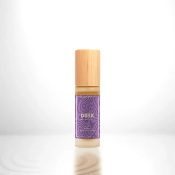 ALKIDO DUSK Nail and Cuticle Oil in a bamboo roller bottle with a purple label on a light background