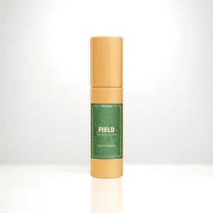 ALKIDO FIELD Nail and Cuticle Oil in a bamboo roller bottle with a green label on a light background