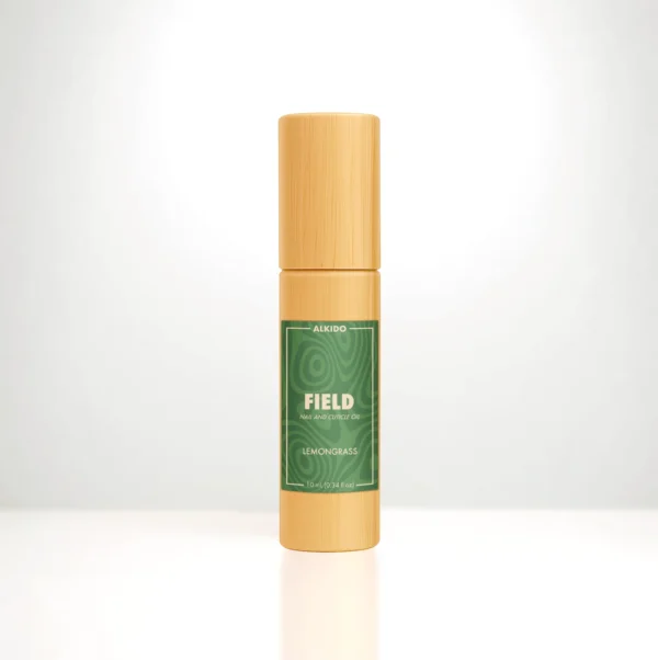 ALKIDO FIELD Nail and Cuticle Oil in a bamboo roller bottle with a green label on a light background