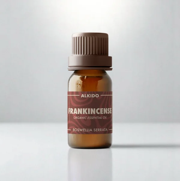 ALKIDO Frankincense organic essential oil in an amber glass bottle with a brown-red label and brown cap on a light background