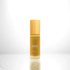 ALKIDO HAZE Nail and Cuticle Oil in a bamboo roller bottle with a yellow label on a light background