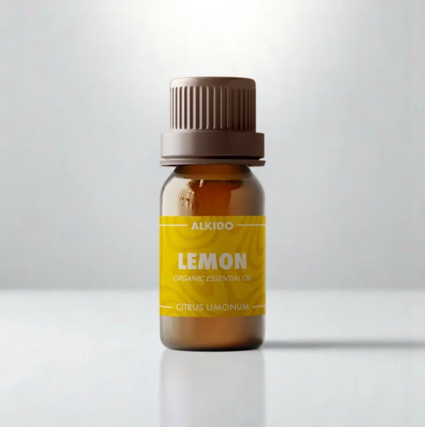 ALKIDO Lemon organic essential oil in an amber glass bottle with a green label and brown cap on a light background