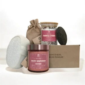 ALKIDO Maroon drift try it all set with scrub jar, bath sponge, lava stone, linen pouch, bath salt jar, and branded box on a light background