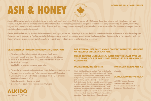 ASH & HONEY spa salt label by ALKIDO, featuring Dead Sea and Himalayan salts with coconut milk, bergamot essential oil, chamomile, and calendula. Bilingual English and French instructions, ingredient list, usage directions, and “Made in Canada” maple icon. Highlighted as containing milk ingredients.