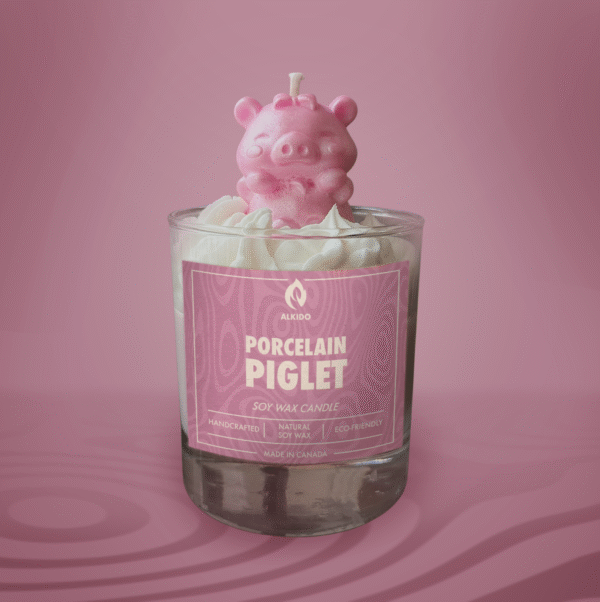 ALKIDO Porcelain Piglet Soy Wax Candle in soft white. Hand-poured, unscented, shaped like a small pig. Vegan, eco-friendly, made in Canada.
