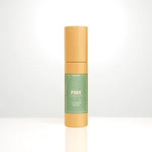 ALKIDO PINE Nail and Cuticle Oil in a bamboo roller bottle with a green label on a light background