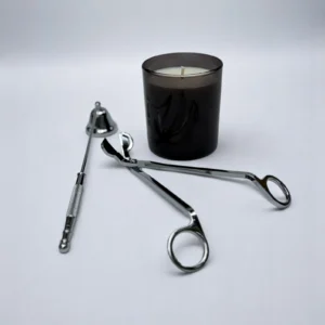 ALKIDO Candle Care Set Silver Edition with black candle, wick trimmer, snuffer on a light background