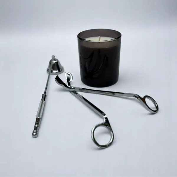 ALKIDO Candle Care Set Silver Edition with black candle, wick trimmer, snuffer on a light background