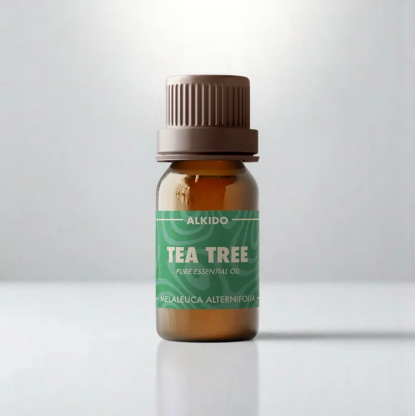 ALKIDO Tea Tree pure essential oil in an amber glass bottle with a green label and brown cap on a light background