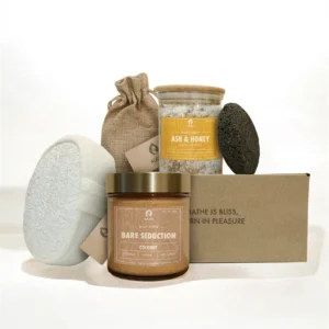 ALKIDO Tropical mist try it all set with scrub jar, bath sponge, lava stone, linen pouch, bath salt jar, and branded box on a light background