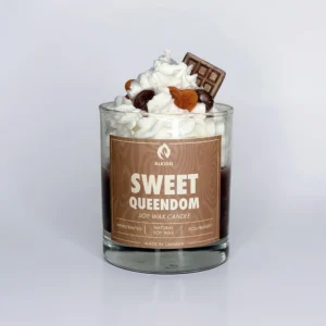 Decorative candle with a chocolate and sweets decor on top and brown label